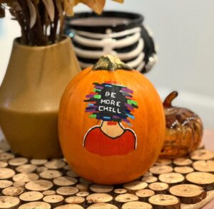 Pumpkin with “Be More Chill” message symbolizing mindfulness and self expression in therapy